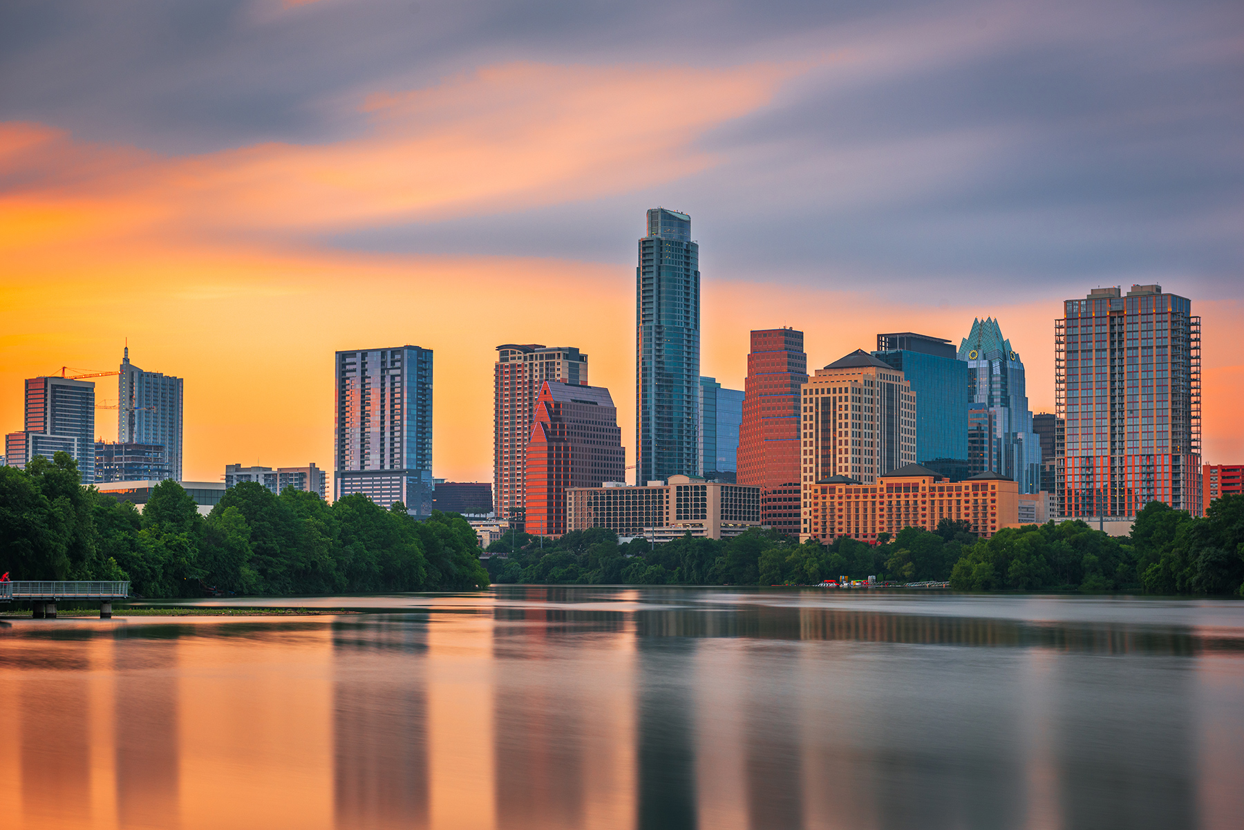 Austin skyline at sunset viewed from Lady Bird Lake and Colorado River